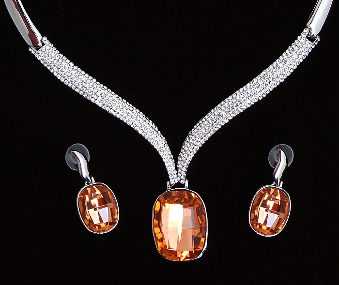 OZON.ru | Комплект "Летиция " от Arrina: ожерелье и серьги-пусеты. Крупные австрийские кристаллы золотистого цвета, прозрачные стразы, бижутерный сплав серебряного тона. Гонконг, | | Интернет-магазин: купить