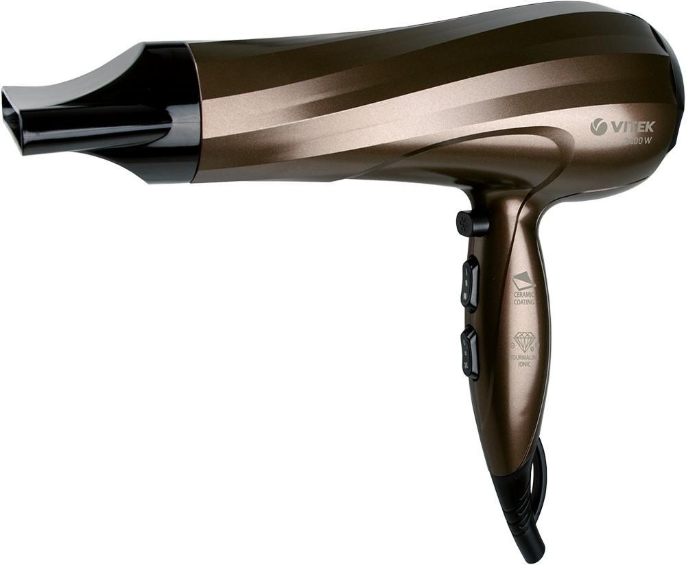Vitek VT-2298(BN) фенVT-2298(BN) Vitek VT-2298(BN) фенVT-2298(BN)Небольшой и удобный фен подойдет тем, кому необходимо поддерживать идеальную форму прически не только дома, но и в поездках. Качественный и надежный «малыш» не подведет вас в «походных» условиях.О чем мечтаете вы, используя фен? Конечно, чтобы укладка получилась идеальной, а волосы всегда оставались здоровыми и красивыми. Мозгый фен VT-2298 BN в полной мере позволит вам получить такой двойной эффект. Одним из преимуществ модели является наличие функций Tourmaline Ionic+ Ceramic Coating: благодаря данной технологии в фене генерируются ионы, которые предотвращают электризацию волос и делают их гладкими как шелк. Фен оснащен 6-ю скоростями работы, поэтому вы всегда можете изменить как температурный режим, так и интенсивность подачи горячего или холодного воздуха. Концентратор в комплекте позволит придать волосам объем у корней, а режим подачи холодного воздуха Cool shot – зафиксировать укладку. Петелька для подвешивания позволит удобно разместить фен, экономя пространство.