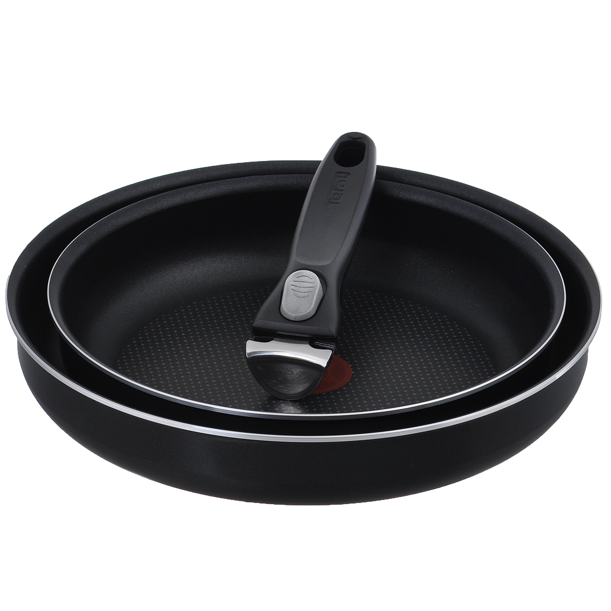 Набор сковородок Tefal Ingenio, с антипригарным покрытием, со съемной ручкой, цвет: черный, 3 предмета. 91000158919100015891 Набор сковородок Tefal Ingenio, с антипригарным покрытием, со съемной ручкой, цвет: черный, 3 предмета. 91000158919100015891Набор Tefal Ingenio состоит из двух сковородок и съемной ручки. Сковороды выполнены из алюминия с противопригорающим покрытием PowerGlide. Уникальная посуда занимает минимум места и дарит вам максимум возможностей! Все дело в съемной ручке со вставками из нержавеющей стали - с ней вы сможете готовить разнообразные блюда, используя небольшой набор посуды. Благодаря такой ручке посуда компактна и складывается по принципу матрешки.Основные преимущества:- Мгновенное распределение тепла, устойчивость к деформации,- Индикатор нагрева Thermo-Spot становится равномерно красным при достижении оптимальной температуры,- Компактность,- Уникальные лучики на дне для оптимального распределения тепла,- Запекание продуктов в духовке.Можно мыть в посудомоечной машине. Подходит для всех типов плит, кроме индукционных.Диаметр сковородок (по верхнему краю): 24 см; 28 см.Диаметр дна сковородок: 20 см; 24 см.Длина ручки: 17 см.Высота стенок сковородок: 5,2 см.Толщина стенок: 3 мм.Толщина дна: 3 мм.