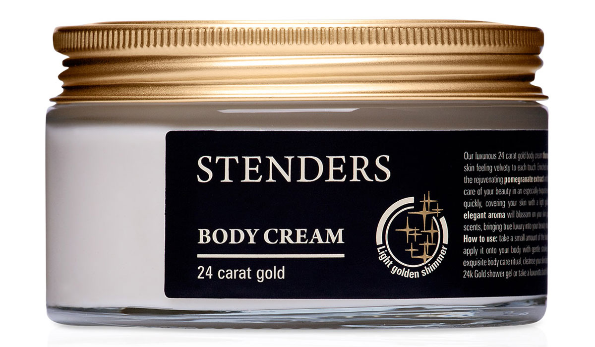 Stenders Крем для тела Золотой с частицами золота, 180 гCBG Stenders Крем для тела Золотой с частицами золота, 180 гCBGНаш утонченный крем для тела с 24-каратным золотом тщательно смягчит вашу кожу, даря вам возможность в каждом прикосновении ощутить ее шелковистую нежность. Для особенно утонченной заботы о вашей красоте крем обогащен частичками 24-каратного коллоидного золота, восстанавливающим экстрактом граната и ценным аргановым маслом. Крем быстро впитается в кожу, придавая ей легкий золотистый блеск. А элегантный аромат будет благоухать на вашей коже подобно букету утонченных духов, даря подлинную роскошь вашим ритуалам красоты.Экстракт плодов граната, напитанных южным солнцем, является богатым источником натуральных антиоксидантов, калия и фосфора. Этот экстракт помогает сохранить естественный уровень влажности кожи, делая ее гладкой и шелковистой. А также он способствует восстановлению клеток кожи, заботясь о её красоте и эластичности. Аргановое масло добывают из плодов арганового дерева. В наши дни аргановое дерево произрастает преимущественно на юго-востоке Марокко, поэтому это ценное масло нередко именуют жидким марроканским золотом. Аргановое масло является ценным подарком природы, используемым для заботы о красоте кожи и волос. Аргановое масло богато ценными натуральными жирными кислотами и витамином Е, оно превосходно увлажняет сухую кожу. Изысканный дизайнерский аромат создает ощущение эксклюзивности и праздника. Цветочный гурман ванильный с нотами аниса, бергамота, апельсина, розы, белых цветов, мускуса и сандала. Золото считается особо эффективным средством для сохранения влажности и эластичности кожи.