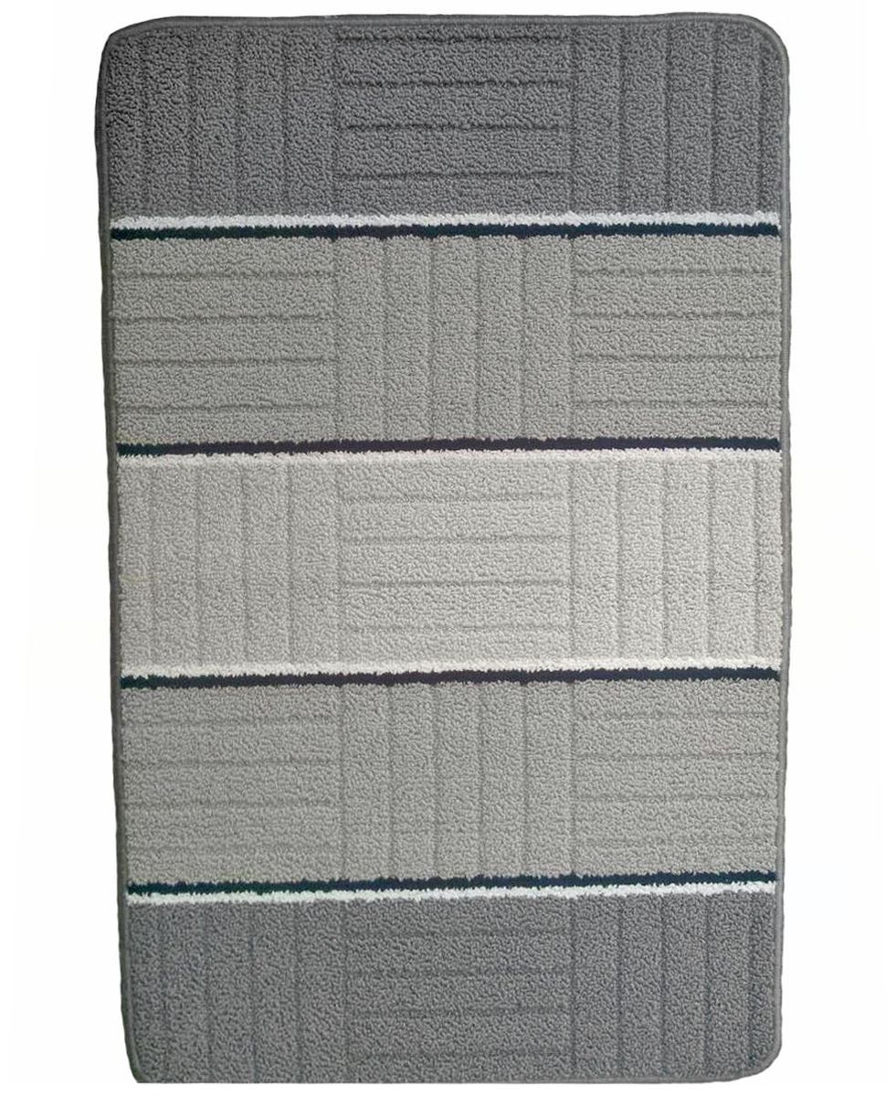 Коврик для ванной Kamalak Tekstil, цвет: серый, 60 x 100 см. УКВ-1002УКВ-1002 Коврик для ванной Kamalak Tekstil, цвет: серый, 60 x 100 см. УКВ-1002УКВ-1002Ковры-паласы выполнены из полипропилена. Ковры обладают хорошими показателями теплостойкости и шумоизоляции. Являются гиппоалергенными. За счет невысокого ворса ковры легко чистить. Вам придется по душе широкая гамма цветов и возможность гармонично оформить интерьер. Практичный и устойчивый к износу ворс - от постоянного хождения не истирается, не накапливает статическое электричество. Структура волокна в полипропиленовых моделях гладкая, поэтому грязь не может выесться, на ворсе она скапливается с трудом. Полипропилен не впитывает влагу, отталкивает водянистые пятна. Уход: Самый простой способ избавить изделие от грязи – пропылесосить его с обеих сторон (лицевой и изнаночной).Влажная уборка с применением шампуней и моющих средств не противопоказана. Если шерсти и шёлку универсальные чистящие составы не подходят, то для синтетики они придутся в самый раз.Хранить их нужно рулоном, не складывая «салфеткой».При надлежащем уходе синтетический ковёр прослужит долго, не утратив ни яркости узора, ни блеска ворса, ни его упругости.