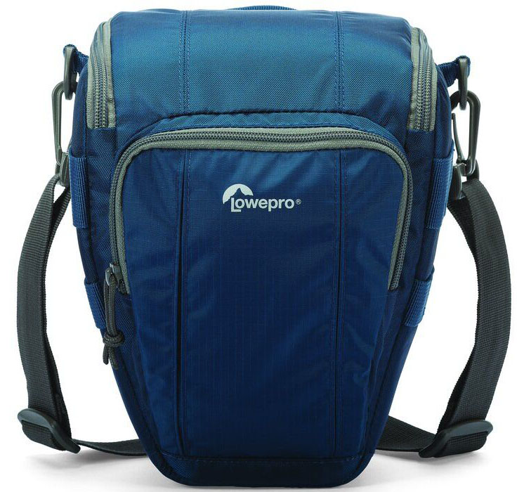 Lowepro Toploader Zoom 50 AW II, Blue сумка для фотокамерыLP36703-0RU Lowepro Toploader Zoom 50 AW II, Blue сумка для фотокамерыLP36703-0RUВторое поколение сумок серии Toploader Zoom AW II предоставляют надежную защиту в течения дня на прогулке, в путешествие или при спортивной съемке. Компактные, оснащенные возможностью быстрого доступа к камере сумки, которые можно носить тремя способами (на плече, поясе или с помощью специальной разгрузочной системы Topload Chest Harness). Бегунки застежек-молний, которые легко открываются и закрываются при низких температурах, имеют специальные D-образные кольца: их просто нащупать, за них легко ухватиться. На светло-серой ткани отделки основного отсека сумок быстрее можно разглядеть нужную вещь.Все сумки серии оснащены встроенным всепогодным защитным чехлом All Weather AW Cover и вместительным фронтальным карманом на молнии для разных полезных мелочей, кошелька или документов