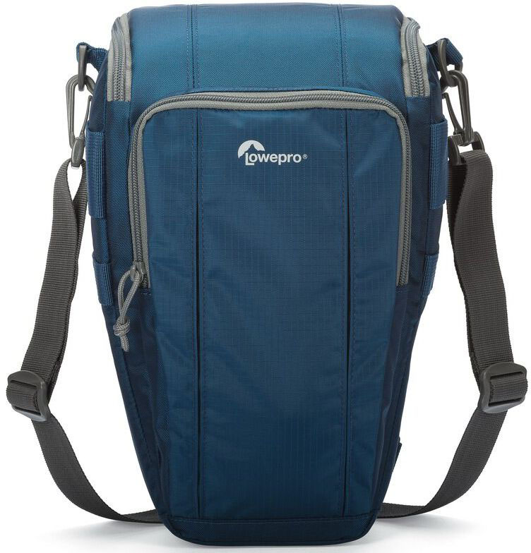 Lowepro Toploader Zoom 55 AW II, Blue сумка для фотокамерыLP36705-0RU Lowepro Toploader Zoom 55 AW II, Blue сумка для фотокамерыLP36705-0RUВторое поколение сумок серии Toploader Zoom AW II предоставляют надежную защиту в течения дня на прогулке, в путешествие или при спортивной съемке. Компактные, оснащенные возможностью быстрого доступа к камере сумки, которые можно носить тремя способами (на плече, поясе или с помощью специальной разгрузочной системы Topload Chest Harness). Бегунки застежек-молний, которые легко открываются и закрываются при низких температурах, имеют специальные D-образные кольца: их просто нащупать, за них легко ухватиться. На светло-серой ткани отделки основного отсека сумок быстрее можно разглядеть нужную вещь.Все сумки серии оснащены встроенным всепогодным защитным чехлом All Weather AW Cover и вместительным фронтальным карманом на молнии для разных полезных мелочей, кошелька или документов
