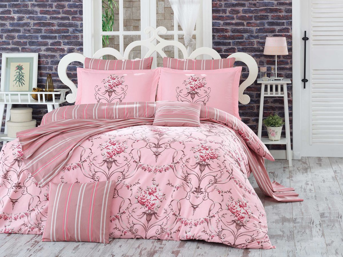Комплект белья Hobby Home Collection Ornella, 2-спальный, наволочки 50х70, 70х70, цвет: розовый1607000068 Комплект белья Hobby Home Collection Ornella, 2-спальный, наволочки 50х70, 70х70, цвет: розовый1607000068Комплект постельного белья Hobby Home Collection изготовлен из высококачественного поплина. Поплин - это ткань, изготавливаемая традиционным полотняным плетением из 100% хлопка, но из нитей разного калибра, за счет чего полотно получается с легким рубчиковым рельефом. По многим характеристикам ткань похожа на бязь, но на ощупь гораздо приятнее — более гладкая и мягкая. Поплин обладает лучшими свойствами ткани для постельного белья. Он плотный и в то же время мягкий на ощупь, износостойкий, немнущийся, гигроскопичный и неприхотливый в уходе, а после стирки практически не нуждается в глажке. Поплин обладает множеством преимуществ: - белье из него плотное, прочное и износостойкое; - не выцветает и не сминается; - не линяет и не деформируется (при стирке до 40°С); - натуральный хлопок в составе обеспечивает абсолютную гигиеничность постельного белья; - поплин хорошо вентилируется и впитывает влагу, отводя ее излишки от тела. По легенде этот материал впервые произвели во французской резиденции Папы Римского, городе Авиньон. За это ткань назвали поплином, что означает папский. С тех пор, вслед за Европой, полотно покорило весь мир, и на сегодня это самый востребованный материал для постельного белья. Постельное белье имеет 3D рисунок. Это объемный рисунок, который позволяет увидеть изображение более реальным, живым. 3D печать на постельном белье невозможна простым способом. Для достижения высокого качества применяется Digital textile printing (англ. Digital textile printing - прямая цифровая печать по текстилю) — способ нанесения изображения на ткань, предполагающий прямую реактивную печать. Сам вид такой печати обеспечивает долговечность нанесенного изображения. На ткань, наносится ультрачеткое и яркое 3D изображение, вследствие чего картинка выглядит очень реалистично. Просматриваются даже самые мелкие детали. Постельное белье из поплина способно не только создать идеальные условия для сна, но и стать настоящим украшением вашей спальни.