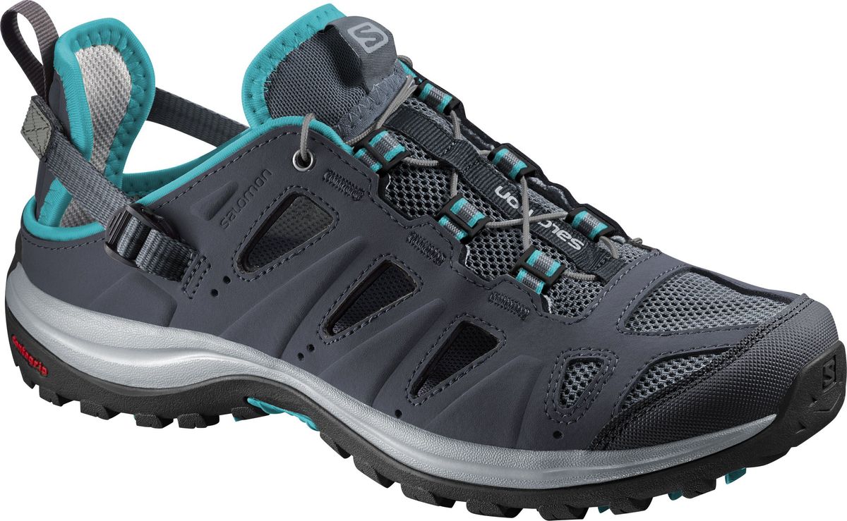 Кроссовки женские Salomon Ellipse Cabrio, цвет: темно-синий. L38159300. Размер 6 (38)L38159300 Кроссовки женские Salomon Ellipse Cabrio, цвет: темно-синий. L38159300. Размер 6 (38)L38159300Трекинговые кроссовки Salomon Ellipse Cabrio выполнены из сочетания быстросохнущего синтетического материала, который выглядят как кожа, и сетчатого текстиля. По канту модель оформлена текстильной нашивкой для лучшего прилегания к ноге, по бокам - перфорацией для лучшей воздухопроницаемости. Удобная шнуровка с фиксатором и регулируемый ремешок с пластиковой пряжкой в области пятки гарантируют надежную фиксацию обуви на ноге. Текстильная подкладка и стелька из ЭВА материала с текстильным верхним покрытием обеспечивают дополнительный комфорт и предотвращают натирание. Задник дополнен ярлычком для более удобного надевания обуви, язычок - текстильной нашивкой с символикой бренда, одна из боковых сторон - принтом в виде логотипа бренда. Технология Contagrip обеспечивает надежность сцепления и высокую износостойкость подошвы благодаря продуманной геометрии и плотности протектора. Такие кроссовки отлично подойдут как для занятия спортом, так и для активного отдыха в сырую или сухую погоду жарким летом.