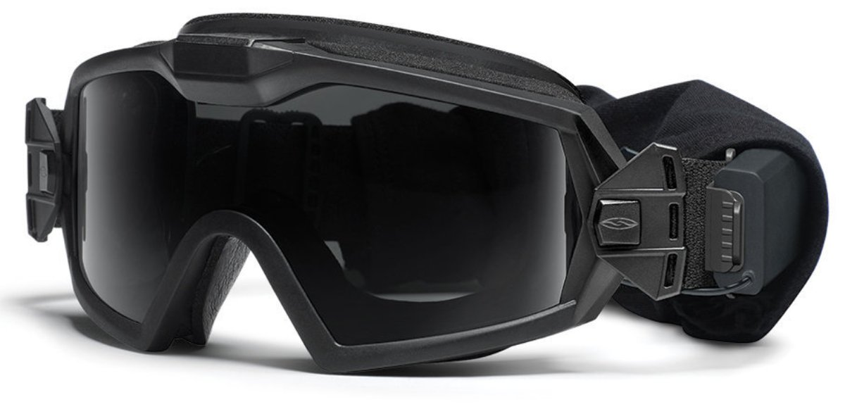 Защитные баллистические очки Smith Optics Outside The Wire Turbo Fan, цвет: черныйOTWTBBK14-2R Защитные баллистические очки Smith Optics Outside The Wire Turbo Fan, цвет: черныйOTWTBBK14-2RЗащитные баллистические очки Smith Optics Outside The Wire Turbo Fan с принудительной вентиляцией надежно фиксируются на голове широким 35-миллиметровым регулируемым эластичным ремешком и обеспечивают максимальную защиту и комфорт в ношении со шлемом.Внутренняя накладка изготовлена из огнеупорного антибактериального материала Прозрачные линзы со светопропусканием 90% и дополнительные сменные линзы со светопропусканием 15% для использования в условиях повышенной освещенности. Все линзы полностью защищают от любого ультрафиолетового излучения. Специальное покрытие предохраняет линзы от царапин и запотевания.Применение запатентованной технологии TLT в изготовлении линз гарантирует отсутствие искажений по краю поля зрения. Очки-маска соответствуют стандарту баллистической защиты MIL-DTL-43511D и EN 166. Встроенный микровентилятор бесшумно работает на двух уровнях мощности , предусмотрена функция автоотключения для экономии заряда батареек. Результатом такой принудительной вентиляции является полное отсутствие внутреннего запотевания. Батарейный отсек закреплен на ремешке маски и надежно защищен от влаги и пыли. При необходимости его можно снять. Кнопка включения легко нажимается даже руками в перчатках Комплект поставки:Очки-маска OTW Turbo Fan с прозрачными линзами Сменные затемненные линзы в матерчатом чехле Батарейки ААА - 2 шт. Плотный футляр для переноски и хранения Картонная упаковочная коробка
