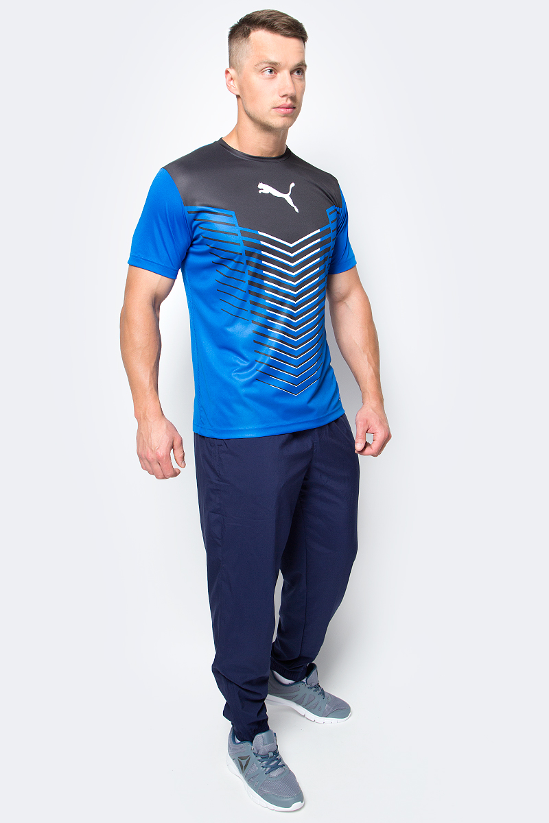 Футболка мужская Puma ftblTRG Graphic Shirt, цвет: голубой. 655206_23. Размер M (46/48)655206_23 Футболка мужская Puma ftblTRG Graphic Shirt, цвет: голубой. 655206_23. Размер M (46/48)655206_23Футболка мужская ftblTRG Graphic Shirt изготовлена из полиэстера. Технологии dryCELL отводит влагу наружу и помогает сохранять сухость и свежесть в течение всей тренировки. Футболка декорирована графическим рисунком и набивным логотипом PUMA на груди по центру. Сзади имеются сетчатые вставки. Модель имеет стандартную посадку, круглый вырез горловины и стандартные короткие рукава. Такая футболка подходит не только для командных видов спорта, она также подойдет для тренировок благодаря высокому качеству и комфорту.