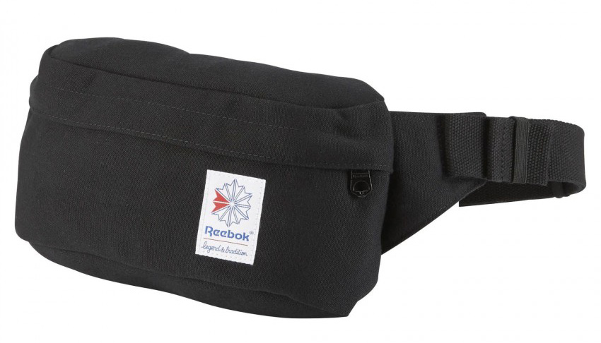 Сумка на пояс Reebok Cl Fo Waistbag, цвет: черный. BQ2233BQ2233 Сумка на пояс Reebok Cl Fo Waistbag, цвет: черный. BQ2233BQ2233Поясная сумка на молнии Reebok Cl Fo Waistbag– то, что нужно, чтобы держать все под рукой. В нее легко поместятся телефон, ключи и бумажник.Сумка выполнена из прочной холщовой ткани.Передний карман на молнии для надежного хранения вещей. Потайной карман на молнии с внутренней стороны. Пластиковая застежка и регулируемый поясной ремень для оптимальной посадки. Вышитый классический логотип.Размеры: 25 х 14 х 7 см.Объем: 3,3 л.