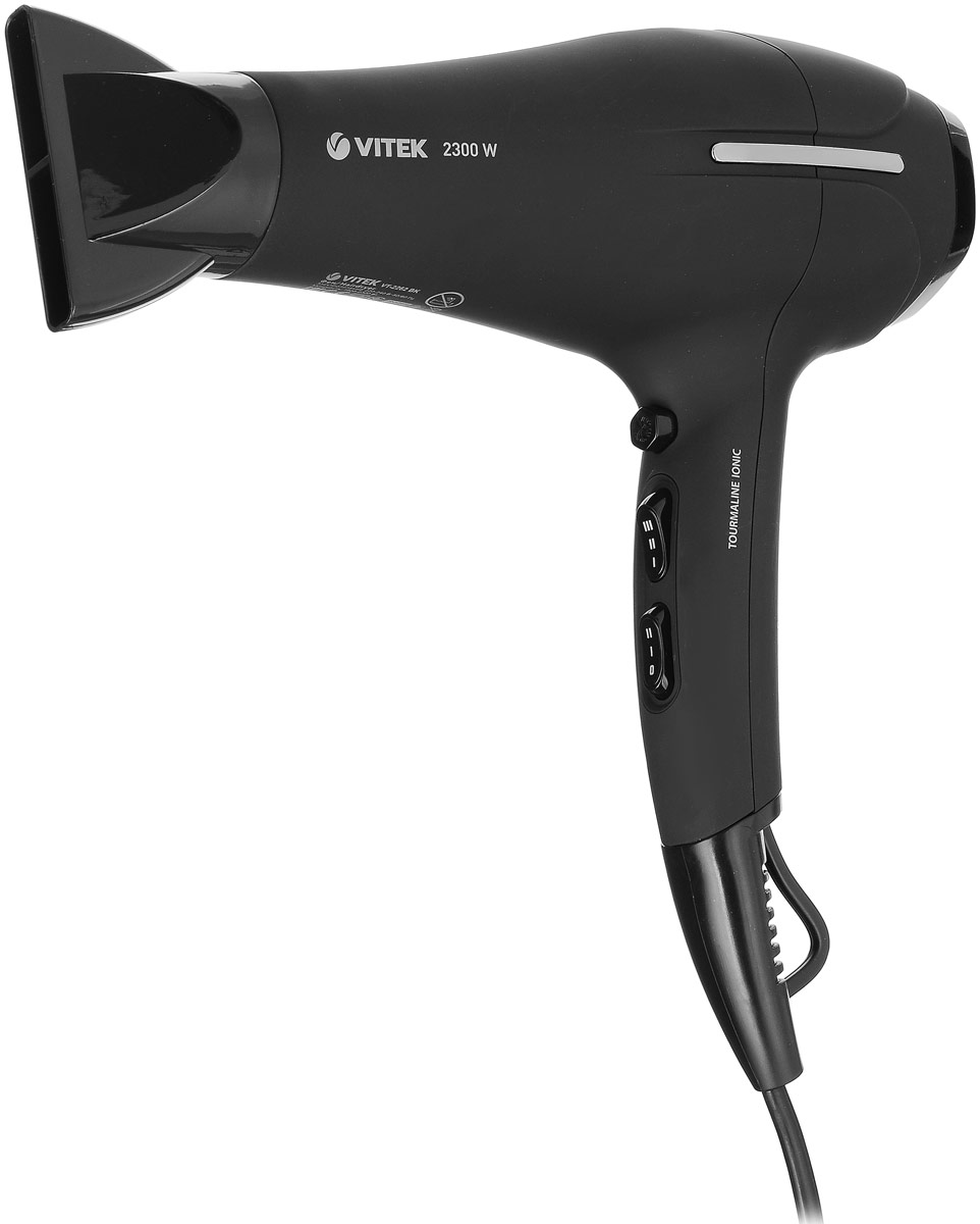 Vitek VT-2262 BK фенVT-2262(BK) Vitek VT-2262 BK фенVT-2262(BK)VITEK, один из ведущих брендов в России по бытовой технике и электронике, входящий в Топ-3 марок по наличию техники в домохозяйствах (по данным M’Index TNS Gallup за 1-й квартал, 2017 г.), представляет фен VT-2262 ВК.Новую модель фена VT-2262 BK особенно оценят любители классики.Модель удачно воплощает в себе актуальный тренд – благородное сочетание формы и цвета.Корпус фена выполнен в приглушенном черном цвете с приятной на ощупь текстурой с матовым флокированным покрытием soft-touchи элегантными черными глянцевыми вставками.Наличие такого покрытия обеспечивает легкое удержание фена в руке и превращает его в стильный аксессуар. Одновременно с оригинальным внешним исполнением в фене предусмотрены все функции для легкого и быстрого создания укладок и сохранения здоровья волос. Одним из преимуществ данного прибора является наличие инновационной технологии Tourmaline Ionic. Благодаря данной функции в фене при нагревании образуются отрицательные ионы, которые запечатывают чешуйки волос, снимают статическое электричество и делают волосы гладкими как шёлк. Фен обладает высокой мощностью — 2300 Вт, что позволяет быстро и легко сушить волосы и создавать укладки. Мощный поток воздуха сокращает время сушки и облегчает создание укладки.Удобное расположение переключателей позволяет легким движение пальца выбрать нужную температуру и скорость воздушного потока. С функцией подачи холодного воздуха вы зафиксируете укладку на целый день. Быстро высушить волосы у корней, создать дополнительный объем и даже подкрутить кончики волос поможет удобный узкий профессиональный концентратор.Для безопасной работы в фене предусмотрена специальная функция защиты от перегрева. Устройство также оснащено съёмным фильтром, который можно легко чистить от пыли и волос. Петелька для подвешивания обеспечивает удобство хранения, а шнур длиной 1,8 м - работу в полный рост.