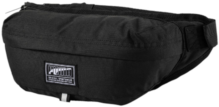 Сумка поясная Puma Academy Waist Bag, цвет: черный, 4 л. 0747220107472201 Сумка поясная Puma Academy Waist Bag, цвет: черный, 4 л. 0747220107472201Поясная сумка имеет главное отделение на молнии, отделение сверху на молнии и функциональную подкладку из полиэстера с изнанкой из полиуретана. Она крепится к поясу плотной тесьмой регулируемой длины с пряжкой. Обращенная к телу часть сумочки отстрочена и имеет мягкую подложку. Символика PUMA представлена на металлических язычках застежек-молний верхнего отделения снаружи и внутреннего кармана на молнии, а также на шнуре из светоотражающего материала, продёрнутого в язычок застежки-молнии главного отделения и на тканом ярлыке с надписью PUMA спереди. Пояс из плотной тесьмы отделан со всех сторон светоотражающим материалом.