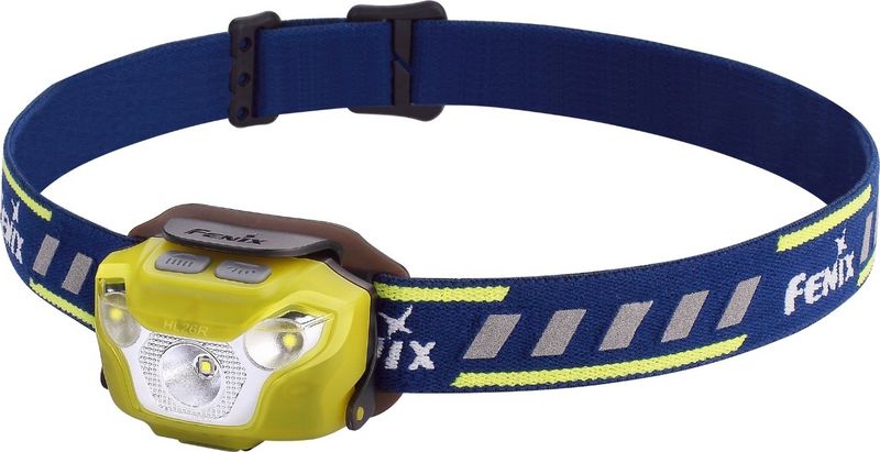 Фонарь налобный Fenix HL26R, цвет: желтыйHL26Rye Фонарь налобный Fenix HL26R, цвет: желтыйHL26RyeОписание налобного фонаря Fenix HL26R:Налобные фонари очень популярны для занятий спортом, поскольку они совершенно не стесняют движений, оставляя руки свободными. Модель Fenix HL26R , в первую очередь, адресована любителям пробежек, но используется и для других занятий спортом или для туризма. Это очень компактный и легкий фонарь, которые предлагает самые разные характеристики освещения для большого количества ситуаций.В Fenix HL26R встроен один диод с четко сфокусированным лучом (XP-G2 R5 от бренда Cree) и два с широким мягким лучом (Nichia). Сфокусированный свет доступен пользователям в четырех режимах с яркостью 450/130/70/30 люмен. В зависимости от яркости, дальность освещения составляет от 30 до 100 метров. Эти режимы используются во время движения и подходят даже велосипедистам для хорошего обзора пути на большой дистанции. Нужно отметить, что в режиме Burst светодиод может сильно нагреваться, поэтому он самостоятельно переключается в более экономный спустя 1 минуту после активации.Вторая группа режимов объединила варианты с широким лучом света. Такое освещение создает оптимальные условия для видимости на ближней дистанции. Радиус луча невелик, зато равномерно освещаются все предметы в достаточно широком секторе. Яркость режимов постоянного света в этой группе составляет 40 люмен и 4 люмена, при дальности 10 и 4 метров. Третьий режим также дает яркость 40 люмен, но используется не для освещения, а для подачи сигналов. Это режим SOS.Питание фонарь Fenix HL26R получает от встроенного не сменного аккумулятора литий-полимерного типа. Этот элемент питания может заряжаться около 500 раз, практически не теряя своей изначальной емкости (1600 мАч). К тому же, он известен низким уровнем саморазряда, если фонарь длительное время будет храниться без использования. В модели Fenix HL26R предустановлена защита от коротких замыканий, а также переразряда и слишком сильного заряда. Отслеживать текущий уровень энергии помогает индикатор, который также встроен в фонарь. Информацию он передает за счет использования маленьких синих диодов, вмонтированных в корпус фонаря ниже всех основных. Если при включении индикатора, зажигается 4 лампочки, значит заряда в аккумуляторе больше 80%. Если 3 лампочки, то 60-80%. Две включенные лампочки говорят об уровне заряда 40-60%. Если включается только 1 из лампочек, то заряда 20-40%. Если же единственная лампочка не светится, а мигает, то заряда осталось не больше 20% и фонарь пора подзарядить. В корпусе для этого есть порт micro-USB, а в комплекте имеется подходящий кабель.Две группы режимов освещения включаются двумя разными кнопками, которые расположились сверху на корпусе фонаря. Чтобы они не могли включиться случайным образом, сверху эти кнопки можно прикрыть специальным пластиковым козырьком. Это поможет избежать нежелательной разрядки аккумулятора.Модель Fenix HL26R крепится на пластиковой базе, относительно которой фонарь можно наклонять до 60°. Сама база присоединена к эластичному наголовному ремешку с небольшими свеоотражающими вставками. Этот фонарь можно использовать каждый раз, когда возникает необходимость качественного дополнительного освещения. В том числе, он будет работать и под дождем, поскольку уровень водонепроницаемости корпуса Fenix HL26R - IP-66.Особенности:налобный фонарь с регулируемым ремешком-креплением;яркость данной модели достигает отметки 450 люмен;на выбор предусмотрено 7 режимов работы;фонарь работает со встроенным в корпус аккумулятором;управление обеспечивается двумя кнопками;есть защита от случайного включения;яркость освещения стабилизируется;в фонарь интегрированы три диода;встроен литий-полимерный аккумулятор;емкость элемента питания — 1600 мАч;отдельные группы для ближнего и дальнего света;уровень защищенности от намокания — IP-66.Гарантия: Гарантия для фонарей Fenix HL26R составляет 2 года и оформляется в день покупки.