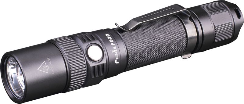 Фонарь ручной Fenix FD30, цвет: черныйFD30 Фонарь ручной Fenix FD30, цвет: черныйFD30Описание фонаря Fenix FD30 Cree XP-L HI LED:Ручные фонари используются как во время поездок на природу, так и во множестве иных ситуаций. Если же вам необходим действительно универсальная модель, советуем обратить внимание на Fenix FD30, который позволяет вручную изменять характеристики луча. Этот фонарь оснащен поворотным кольцом, которое при вращении изменяет положение линзы относительно светодиода (кстати, здесь встроен Cree XP-L). таким образом, луч света будет то дальним и узким, то широким, но коротким. Поэтому с помощью Fenix FD30 можно освещать территорию около палатки или же использовать его во время ходьбы по тропе после захода солнца. Ширина луча варьируется в пределах 7°-76°. При этом, максимальная дистанция, на которую будет проникать свет от этого фонаря, равна 200 метров. Это при условии яркости 900 люмен и максимальной фокусировке.Также пользователям доступны режимы с яркостью света 350, 150, 50 и 8 люмен. Также фонарь дополнительно поддерживает режим стробоскопа, что позволяет передавать с его помощью хорошо видные издалека сигналы.Поскольку работа с высокой яркостью света приводит к постепенному нагреванию фонаря, производители снабдили его механизмом защиты от перегрева. Он включается, как только температура внутри оптического узла достигает 65°С. Сразу же после этого, фонарь переключается в следующий по экономности режим, чтобы дать диоду возможность остыть. Нужно иметь ввиду, что яркость также может самостоятельно снижаться в случае нехватки заряда аккумулятора. Если же Fenix FD30, работающий в самом неярком режиме, начинает периодически мигать, это указывает на необходимость установки свежих элементов питания. Производители советуют использовать один из фирменных аккумуляторов размера 18650, однако помимо того допускается установка литиевых батареек (2 в комплекте) размера CR123A.Чтобы включать и использовать фонарь Fenix FD30 можно было в любую погоду и круглый год, инженеры компании также позаботились о его физической защищенности. Алюминиевый корпус оберегает все внутренние системы от ударов и повреждений в результате падения фонарика. А качественная сборка делает его полностью водонепроницаемым и неуязвимым для пыли или грязи.Особенности:используется светодиод под названием Cree XP-L HI;верхний предел яркости - 900 люмен;пользователь выбирает освещение из 6 режимов;возможна фокусировка луча вручную;пределы для изменения угла луча - 7°-76°;фонарь светит до 200 метров вдаль;рекомендуется использовать аккумуляторы 18650;металлический корпус (алюминий);IP-68 стандарт защищенности от воды;встроенная стабилизация яркости.Гарантия: Фонари Fenix FD30 можно купить с официальной гарантией производителей, сохраняющейся в течение 5 лет после приобретения.