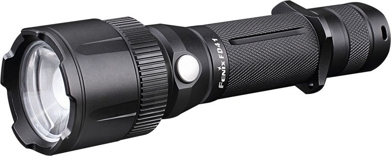 Фонарь ручной Fenix FD41, цвет: черныйFD41 Фонарь ручной Fenix FD41, цвет: черныйFD41Описание фонаря Fenix FD41 Cree XP-L HI LED:Универсальный фонарь Fenix FD41 подойдет для туризма, любых поездок на природу, использования во время занятий спортом, поездок на дачу или во множестве других ситуаций. Он оборудован мощным и долговечным диодом под названием Cree XP-L. Преимущества такого диода не только в высокой производительности, дающей яркость до 900 люмен, но и в долговременности. По информации производителей, работать он будет более 50 000 часов.Модель Fenix FD41 в состоянии работать в одном из пяти запрограммированных режимов, чтобы в максимальном числе ситуаций предложить пользователю оптимальное освещение. Для подсветки ближайших предметов подойдет режим Low c яркостью 10 люмен. Два следующих режима — это Mid, рассчитанный на 150 люмен и High с яркостью 350 люмен. Они могут использоваться на рыбалке, в туристическом лагере или кемпинге. Ну а в ситуациях, когда необходимо максимальное количество света, можно использовать режим Turbo, яркость в котором составляет 900 люмен. Помимо того, пользователям доступен сигнальный режим Strobe, работающий также на максимальной яркости. Самое большое расстояние, на котором будет эффект от света фонаря Fenix FD41, равно 340 метров. Минимальное — 6 метров. Уникальным качеством модели Fenix FD41 является возможность для пользователей самостоятельно изменять фокусировку луча. Чем лучше он сфокусирован, тем дальше будет проникать луч света. Чем менее сфокусирован луч, тем он будет шире, равномерно освещая пространство. Изменение фокусировки осуществляется за счет поворота кольца.Удобно и то, что фонарь в состоянии светить с любым из двух видов элементов питания: одним аккумулятором 18650 или двумя одноразовыми батарейками CR123А. При этом, фонарь имеет встроенную защиту от переполюсовки и, как следствие, короткого замыкания. Данная модель также оснащается драйвером, стабилизирующим яркость. Еще один контроллер отвечает за то, чтобы Fenix FD41 не перегревался. Если температура его оптического узла превысит допустимую норму, фонарь тут же снизит яркость, чтобы остыть.Еще одна важная особенность — это абсолютная влагоизоляция фонарика. Благодаря соответствию стандарту IP-68, он может без ограничений использоваться в любую погоду. Более того, Fenix FD41 способен полчаса пребывать включенным под водою, хотя производители и рекомендуют ограничиться глубиною 2 метра.Особенности:функция регулирования длины и ширины луча;доступна яркость равная 900 люмен;5 вариантов рабочих режимов;используется мощный диод Cree XP-L;подходящие варианты элементов питания - 18650 и CR123A;максимальная дистанция для освещения составляет 340 метров;удобное управление режимами освещения;простая смена фокусного расстояния для луча;все необходимые механизмы для защиты фонаря от повреждений;для корпуса используется авиационный алюминий;поддерживается стандарт IP-68 по водонепроницаемости;вес фонаря до установки элементов питания - 160 грамм.Гарантия: Любой из фонарей Fenix FD41 продается с официальной гарантией, срок действия которой составляет 5 лет.Скачать инструкцию