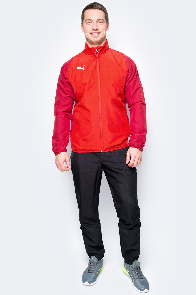 Спортивный костюм мужской Puma ftblTRG Woven Tracksuit, цвет: красный, черный. 65535051. Размер M (46/48)65535051 Спортивный костюм мужской Puma ftblTRG Woven Tracksuit, цвет: красный, черный. 65535051. Размер M (46/48)65535051Спортивный костюм от Puma состоит из толстовки и брюк.Толстовка декорирована логотипом Puma, нанесенным на правую сторону груди методом термопечати. Изделие полностью посажено на подкладку. Среди других его отличительных особенностей – удобные боковые карманы и отделка эластичным материалом манжет и подола.Брюки декорированы логотипом Puma, нанесенным на левую штанину методом термопечати. Пояс посажен на подкладку из эластичного материала, а все изделие – на легкую сплошную подкладку. Штанины внизу снабжены застежками молниями. Боковые карманы удобны и вместительны. Фасон в обтяжку по фигуре с зауженными штанинами очень элегантен.