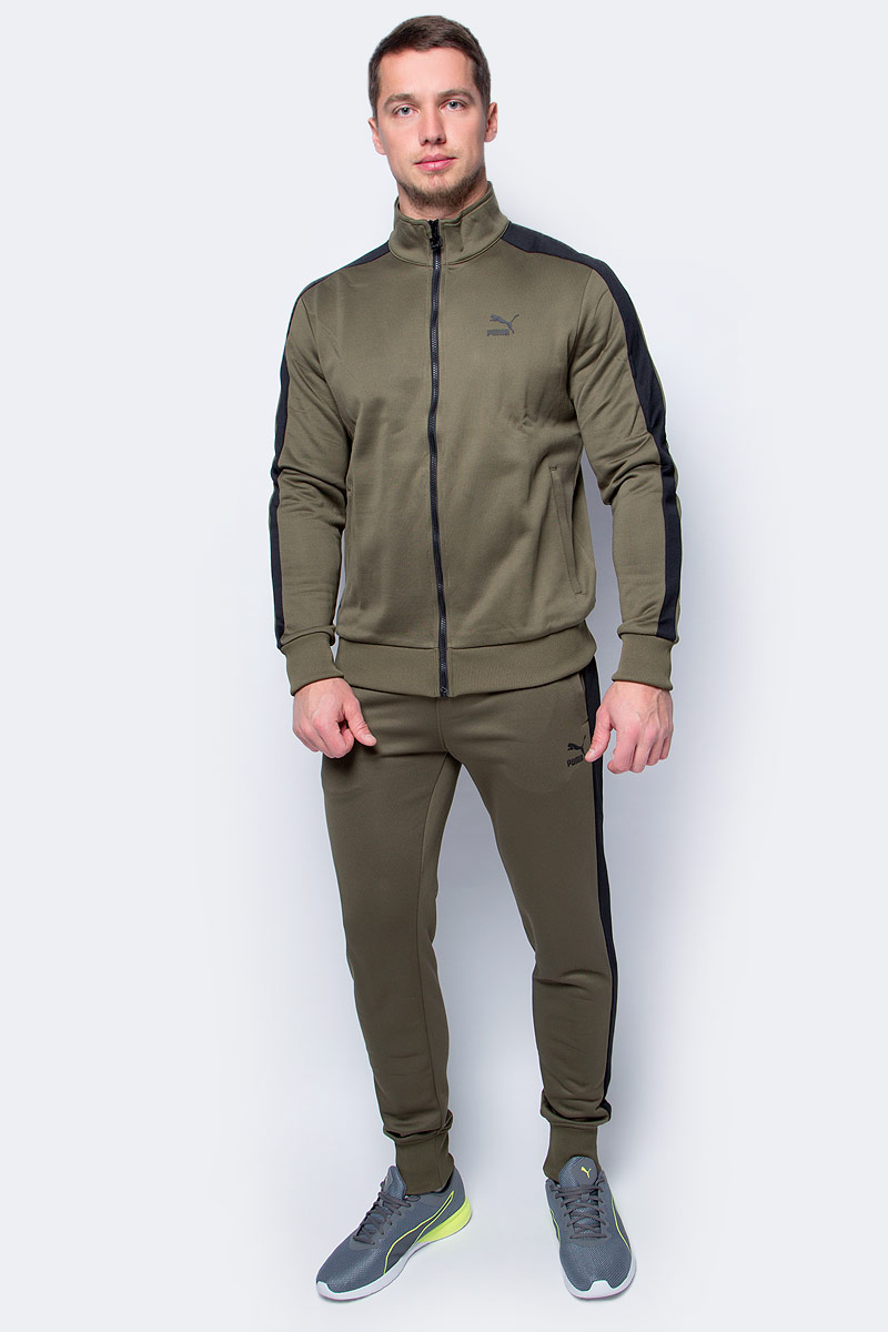 Толстовка мужская Puma Archive T7 track, цвет: темно-зеленый. 57331214. Размер L (48/50)57331214 Толстовка мужская Puma Archive T7 track, цвет: темно-зеленый. 57331214. Размер L (48/50)57331214Модель декорирована с лицевой стороны набивным логотипом винтажной коллекции Puma, нанесенным методом пигментной печати, а также набивным рисунком с фирменной символикой на подкладке кармана. Кроме того, сзади на подоле нашит ярлык с логотипом винтажной коллекции Puma. Фирменные вставки в рукава подчеркивают принадлежность модели популярной серии одежды от Puma для спорта и отдыха. Скрытые карманы на молнии спереди удобны и вместительны.Манжеты и подол отделаны эластичным трикотажем в рубчик, что отлично дополняет оригинальный фасон, совершенно не стесняющий движений. Изделие имеет удобную стандартную посадку.