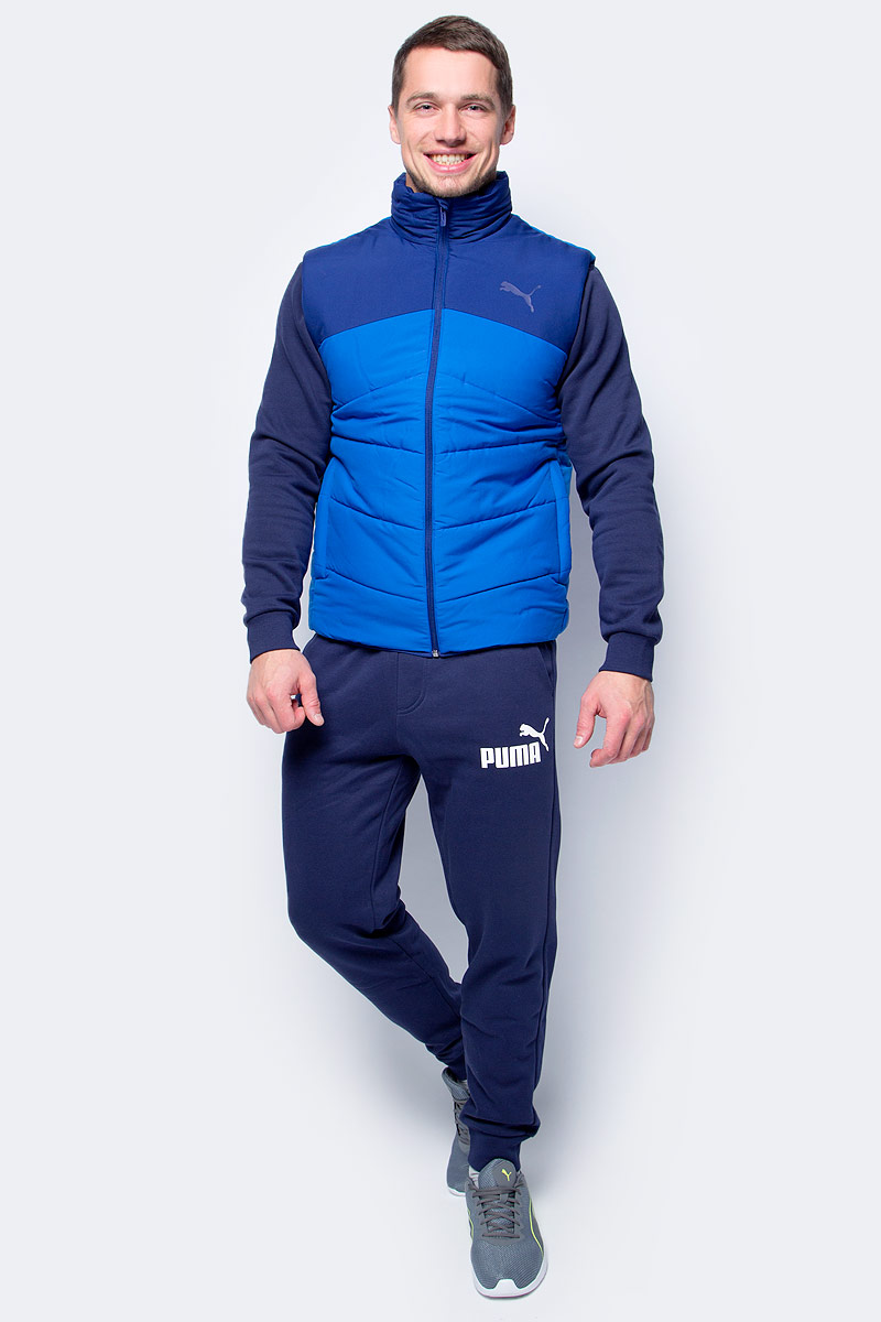 Жилет мужской Puma ESS Padded Vest, цвет: голубой, синий. 59235508. Размер XXL (52/54)59235508 Жилет мужской Puma ESS Padded Vest, цвет: голубой, синий. 59235508. Размер XXL (52/54)59235508Модель декорирована логотипом и другой фирменной символикой Puma, нанесенными методом пигментной печати. Высокий воротник надежно защищает подбородок и шею от холода. Боковые карманы на молнии вместительны и удобны. Боковые швы с нахлестом вперед обеспечивают полную свободу движений, как и отделка эластичным материалом подола. При этом удлиненный задний подол надежно защищает поясницу. С изнанки имеется удобный карман для электронных гаджетов с клапаном и петлицей. Также имеется петля для вешалки. Стандартная посадка создает полный комфорт.