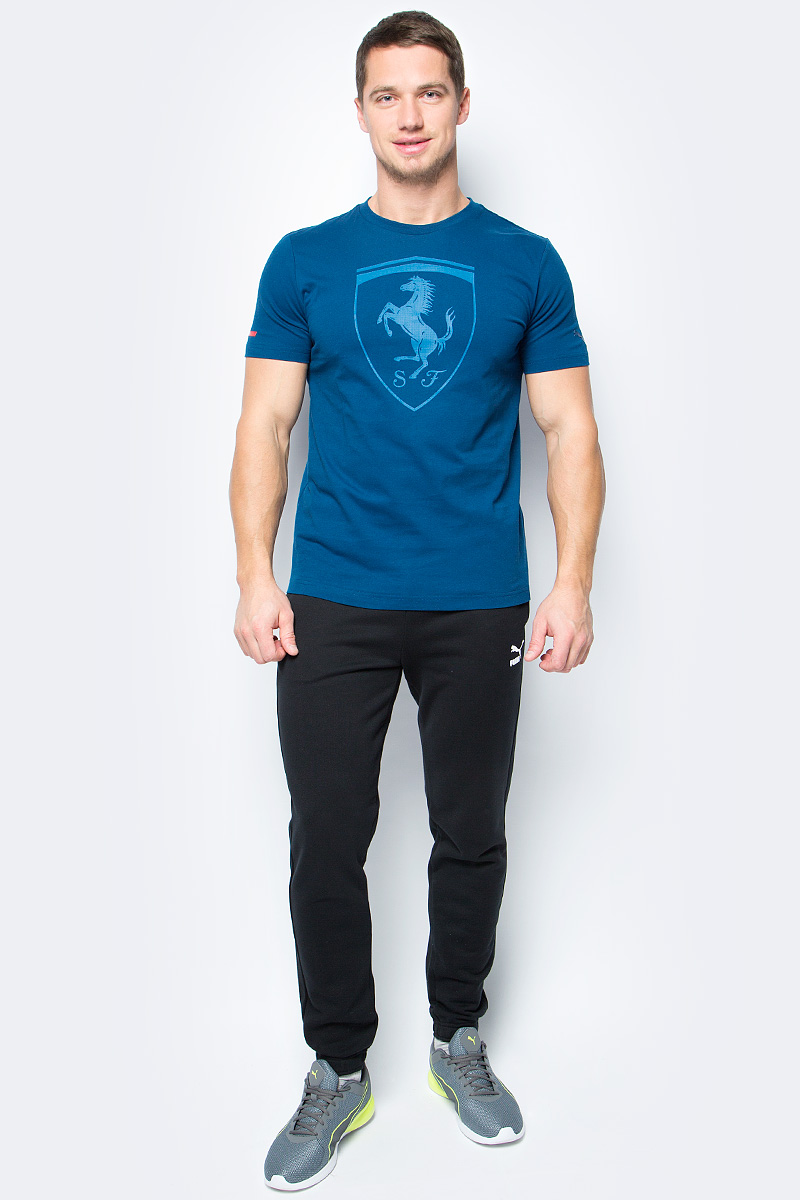 Футболка мужская Puma Ferrari Big Shield Tee, цвет: синий. 57346705. Размер M (46/48)57346705 Футболка мужская Puma Ferrari Big Shield Tee, цвет: синий. 57346705. Размер M (46/48)57346705Модель декорирована прорезиненной эмблемой Ferrari, набивной надписью Ferrari с прорезиненными элементами, а также набивным логотипом Puma с прорезиненными деталями. Отделка сзади выполнена контрастной тесьмой.
