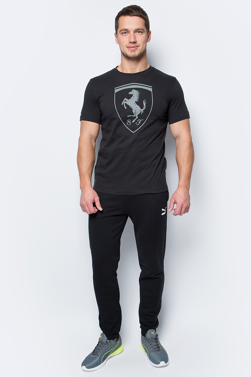 Футболка мужская Puma Ferrari Big Shield Tee, цвет: черный. 57346701. Размер L (48/50)57346701 Футболка мужская Puma Ferrari Big Shield Tee, цвет: черный. 57346701. Размер L (48/50)57346701Модель декорирована прорезиненной эмблемой Ferrari, набивной надписью Ferrari с прорезиненными элементами, а также набивным логотипом Puma с прорезиненными деталями. Отделка сзади выполнена контрастной тесьмой.