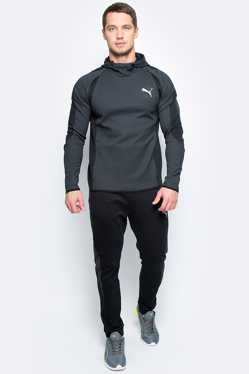 Толстовка мужская Puma Evostripe Ultimate Hoody, цвет: черный. 59261901. Размер L (48/50)59261901 Толстовка мужская Puma Evostripe Ultimate Hoody, цвет: черный. 59261901. Размер L (48/50)59261901Модель декорирована ярким серебристым светоотражающим логотипом Puma, нанесенным методом термопечати, и изготовлена с использованием высокофункциональной технологии WarmCell, которая благодаря дышащим свойствам материала удерживает тепло и сохраняет оптимальную температуру вашего тела даже в холодную погоду. Объем капюшона регулируется затягивающимися шнурами со стопорами. Скрытые в боковых швах карманы на молнии вместительны и удобны. Эластичные затягивающиеся шнуры в подоле и манжетах отлично дополняют эргономичный фасон в обтяжку по фигуре, обеспечивающий полную свободу движений.