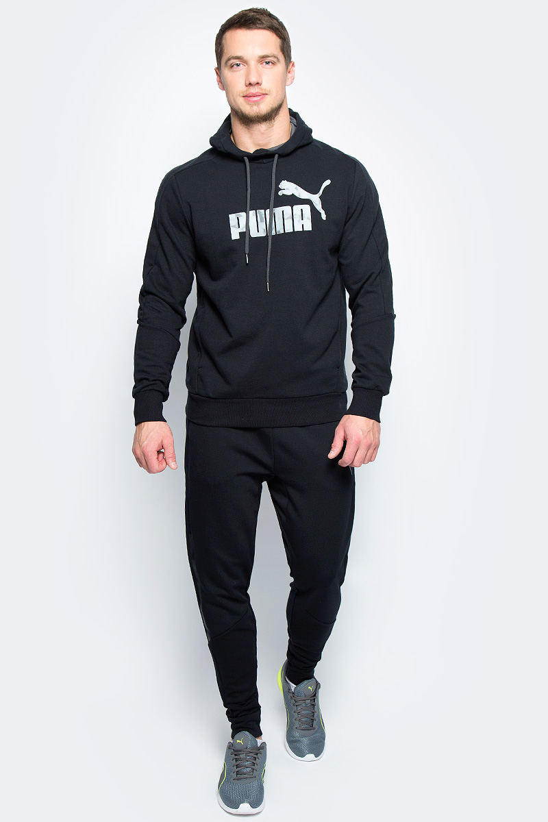 Худи мужское Puma Hero Hoody Tr, цвет: черный. 838374_31. Размер XXL (52/54)838374_31 Худи мужское Puma Hero Hoody Tr, цвет: черный. 838374_31. Размер XXL (52/54)838374_31Удобное мужское худи Hero Hoody Tr изготовлено из хлопка с добавлением полиэстера. Высокофункциональная технология dryCELL отводит влагу, поддерживает тело сухим даже при интенсивных нагрузках и гарантирует максимальный комфорт. Модель имеет длинные стандартные рукава. Фирменный покрой рукавов обеспечивает свободу движений. Среди других особенностей изделия - отделка тесьмой сзади по вороту с фирменной символикой, капюшон регулируемой формы с трикотажной подкладкой, боковые карманы в швах. Низ и манжеты рукавов выполнены из эластичного трикотажа в рубчик. Спереди модель украшена надписью PUMA и логотипом бренда. Такое худи отлично подойдет для занятий спортом и повседневной носки.