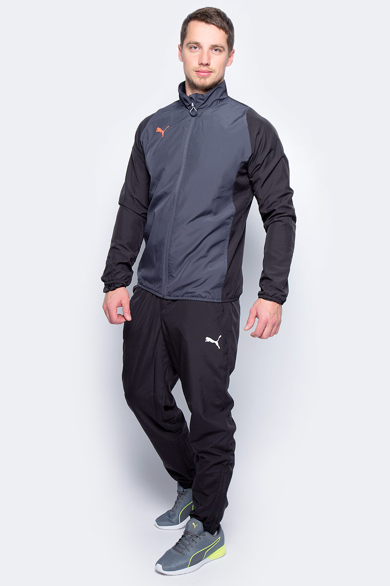 Спортивный костюм мужской Puma ftblTRG Woven Tracksuit, цвет: серый, черный. 65535003. Размер S (44/46)65535003 Спортивный костюм мужской Puma ftblTRG Woven Tracksuit, цвет: серый, черный. 65535003. Размер S (44/46)65535003Спортивный костюм от Puma состоит из толстовки и брюк.Толстовка декорирована логотипом Puma, нанесенным на правую сторону груди методом термопечати. Изделие полностью посажено на подкладку. Среди других его отличительных особенностей – удобные боковые карманы и отделка эластичным материалом манжет и подола.Брюки декорированы логотипом Puma, нанесенным на левую штанину методом термопечати. Пояс посажен на подкладку из эластичного материала, а все изделие – на легкую сплошную подкладку. Штанины внизу снабжены застежками молниями. Боковые карманы удобны и вместительны. Фасон в обтяжку по фигуре с зауженными штанинами очень элегантен.