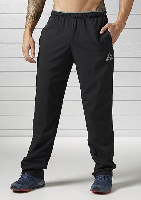 Брюки спортивные мужские Reebok Wor Woven Pant, цвет: черный. BK3090. Размер S (44/46)BK3090 Брюки спортивные мужские Reebok Wor Woven Pant, цвет: черный. BK3090. Размер S (44/46)BK3090Мягкие брюки, в которых удобно и тренироваться, и отдыхать. Отлично подходят для тренировок и повседневной носки. Комфортная посадка для полной свободы движений и боковые карманы для хранения мелочей.Материал: облегчённый трикотажОблегающий крой отлично подходит для интенсивных тренировок и совершенно не стесняет движенийТехнология Speedwick отводит влагу с поверхности тела, оставляя ощущение сухости и комфортаПояс на шнурке для оптимальной посадкиЦветные вставки по бокамБоковые карманы для хранения бумажника и ключей