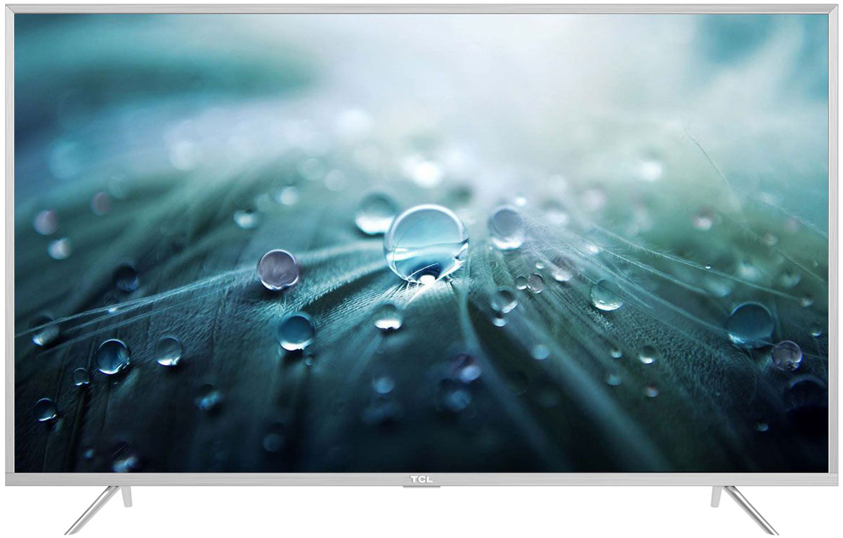 TCL L65P2US, Silver телевизорL65P2US TCL L65P2US, Silver телевизорL65P2USНа экране телевизора TCL L65P2US вы всегда будете видеть идеальное изображение формата 4К, вне зависимости от качества видеосигнала. За его обработку отвечает высокопроизводительный 64-х битный процессор, автоматически анализирующий и конвертирующий картинку и звук. Загружайте новый контент, смотрите фильмы, слушайте музыку - в наилучшем качестве!Сверхчеткое изображение нового телевизора TCL позволит в динамике рассмотреть ранее недоступные мельчайшие детали, наслаждаясь насыщенностью цветов и контрастностью! Стандарт видеоизображения позволяет просматривать фильмы и компьютерную графику в разрешении 4К - 3840 x 2160.Телевизоры TCL имеют самую современную технологию прорисовки полутонов, позволяющую добиваться невероятной реалистичности картинки. Вы видите на экране до миллиарда тончайших цветовых тонов, которые делают изображение неотличимым от оригинала.Smart-телевизоры TCL откроют для вас новый мир, объединяющий сотни и тысячи телеканалов, интернет-серфинг и вселенные онлайн-игр. Загружайте любимые фильмы, делитесь своими лучшими фотографиями и видеозаписями в социальных сетях, слушайте музыку и узнавайте интересующие вас новости с помощью удобных предустановленных приложений.Встроенная технология для беспроводного подключения к телевизору TCL различных внешних устройств, в том числе акустических систем, наушников, клавиатур и джойстиков, имеющая дальность действия до 100 м.Процессор 4K в сочетании с технологией UHD Upscaling передает цвета более естественно в ярких сценах, делая изображение реалистичнее. Поддержка масштабирования изображения до разрешения 4К при просмотре видео обеспечивает невероятное богатство деталей, естественную цветопередачу и контрастность, а тональные переходы получаются более плавными.