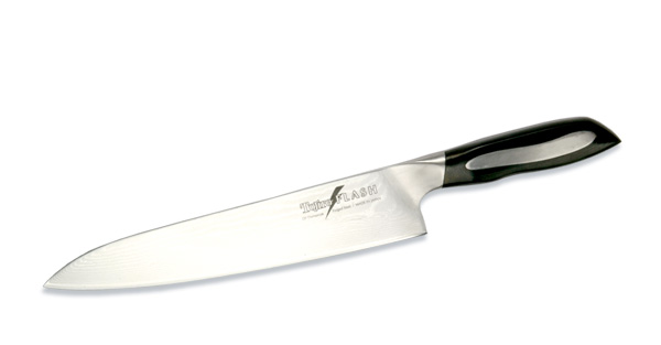 Нож поварской Tojiro Flash, длина лезвия 24 см12520 Нож поварской Tojiro Flash, длина лезвия 24 см12520Поварской нож Tojiro Flash выполнен из высококачественной 63-слойной нержавеющей стали, обладающей высокой твердостью и устойчивостью к коррозии. Лезвие обтекаемой формы оформлено японскими иероглифами. Эргономичная ручка позволяет держать нож свободно и максимально удобно.Рукояти ножей серии Tojiro Flash Damascus изготовлены с использованием материала Micarta. Этот материал используется при изготовлении туристических и охотничьих ножей, ножей, которые должны выдерживать экстремальные нагрузки при эксплуатации в неблагоприятных условиях. Стальные накладки рукояти приварены к хвостовику и окружены Micarta. Сталь придает рукоятям ножей серии Tojiro Flash Damascus должный вес, а Micarta обеспечивает неповторимый комфорт при работе этими ножами.Клинки ножей серии Tojiro Flash Damascus изготовлены из стали VG-10, разработанной специально для производства ножей. Клинки заточены до невероятной остроты, финишная заточка производится на японских водных камнях. Это обеспечивает клинкам ножей серии Tojiro Flash Damascus долгое сохранение высокой остроты.Такой нож займет достойное место среди аксессуаров на вашей кухне. Правила эксплуатации: - Хранить нож следует в сухом месте. - После использования, промойте нож теплой водой и протрите насухо. - Оставление ножа в загрязненном состоянии может привести к образованию коррозии. Запрещается: - Мыть нож в посудомоечной машине. - Хранить ножи в одной емкости со столовыми приборами. - Резать на твердых поверхностях: каменных столешницах, керамических тарелках, акриловых досках. - Запрещается нецелевое использование ножа: вскрывать консервные банки, разрезать кости, скоблить твердые поверхности, резать замороженные продукты. Правка производится легкими движениями на водном камне или мусате. Заточка ножа - сложный технологический процесс, должен производиться профессионалом на специальном оборудовании. Услуга по заточке ножа предоставляется специалистами компании «Тоджиро». Характеристики:Материал: нержавеющая сталь, микарта. Общая длина ножа: 37 см. Длина лезвия: 24 см. Размер упаковки: 48 см х 10 см х 3 см. Артикул: FF-CH240.Уважаемые клиенты! В случае несоблюдения правил эксплуатации, нож не подлежит гарантийному обслуживанию.