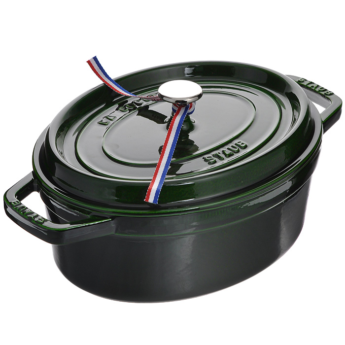 Кокот чугунный Zwilling Staub с крышкой, овальный, цвет: зеленый базилик, 3,2 л. 1102785TLY081-CK-AL Кокот чугунный Zwilling Staub с крышкой, овальный, цвет: зеленый базилик, 3,2 л. 1102785TLY081-CK-ALОвальный кокот Zwilling Staub выполнен из чугуна с внешним эмалевым покрытием цвета зеленого базилика. Внутренняя поверхность покрыта двумя слоями матовой эмали специального состава.Чугун - это один из материалов, который лучше всего сохраняют тепло, медленно его проводит и равномерно распределяет. Блюдо в таком кокоте не потребует повторного разогрева в течение достаточно длительного промежутка времени. Кокот так же хорошо сохраняет и холод, для этого достаточно поставить блюдо в холодильник перед его подачей на стол. Эмаль позволяет обеспечить лучшее сопротивление перепадам температуры и образованию царапин, а также облегчает уход за посудой. Эмалевое покрытие обладает идеальными качествами для запекания, жарки и карамелизования пищевых продуктов. Такой кокот идеально подходит для приготовления блюд, которые требуют длительного тушения. Например, плов, овощное рагу или всевозможные каши не доводят до готовности на огне, а оставляют томиться, как в печке. При этом пища сохраняет свои полезные и питательные свойства и не наполняется вредными канцерогенами. Изделие оснащено удобной плоской крышкой с шипами Picots. Это эксклюзивное инновационное решение позволяет каплям конденсата равномерно орошать готовящееся блюдо. Мясо остается таким же нежным, а овощи - мягкими. Никелированная ручка позволяет использовать кокот в духовом шкафу до 250°С. Благодаря дизайну крышки чугунный кокот теряет намного меньше влаги во время приготовления пищи. По истечении 55 минут процесса приготовления пищи в кокоте сохраняется на 10% больше влаги по сравнению с другими чугунными кокотами.Подходит для использования на всех типах плит (газовые, электрические, галогенные, стеклокерамические, индукционные). Можно использовать в духовом шкафу и мыть в посудомоечной машине. Перед первым использованием вымыть горячей водой, высушить на слабом огне, затем смазать растительным маслом изнутри. Погреть несколько минут на слабом огне и вытереть избыток масла. Мыть жидким моющим средством, без применения абразивных веществ и металлических губок. При падении на твердую поверхность посуда может треснуть или разбиться. Металлические кухонные принадлежности могут повредить посуду. Чтобы не обжечься, пользуйтесь прихватками. В комплекте - брошюра с советами по использованию и рецептами. Характеристики:Материал: чугун, никель. Цвет: зеленый базилик. Объем: 3,2 л. Размер кокота: 26,5 см х 21 см. Высота стенки: 10 см. Толщина стенки: 0,3 см. Толщина дна: 0,7 см. Размер дна: 22,5 см х 17 см. Размер упаковки: 34 см х 23 см х 11,5 см. Артикул: 1102785.