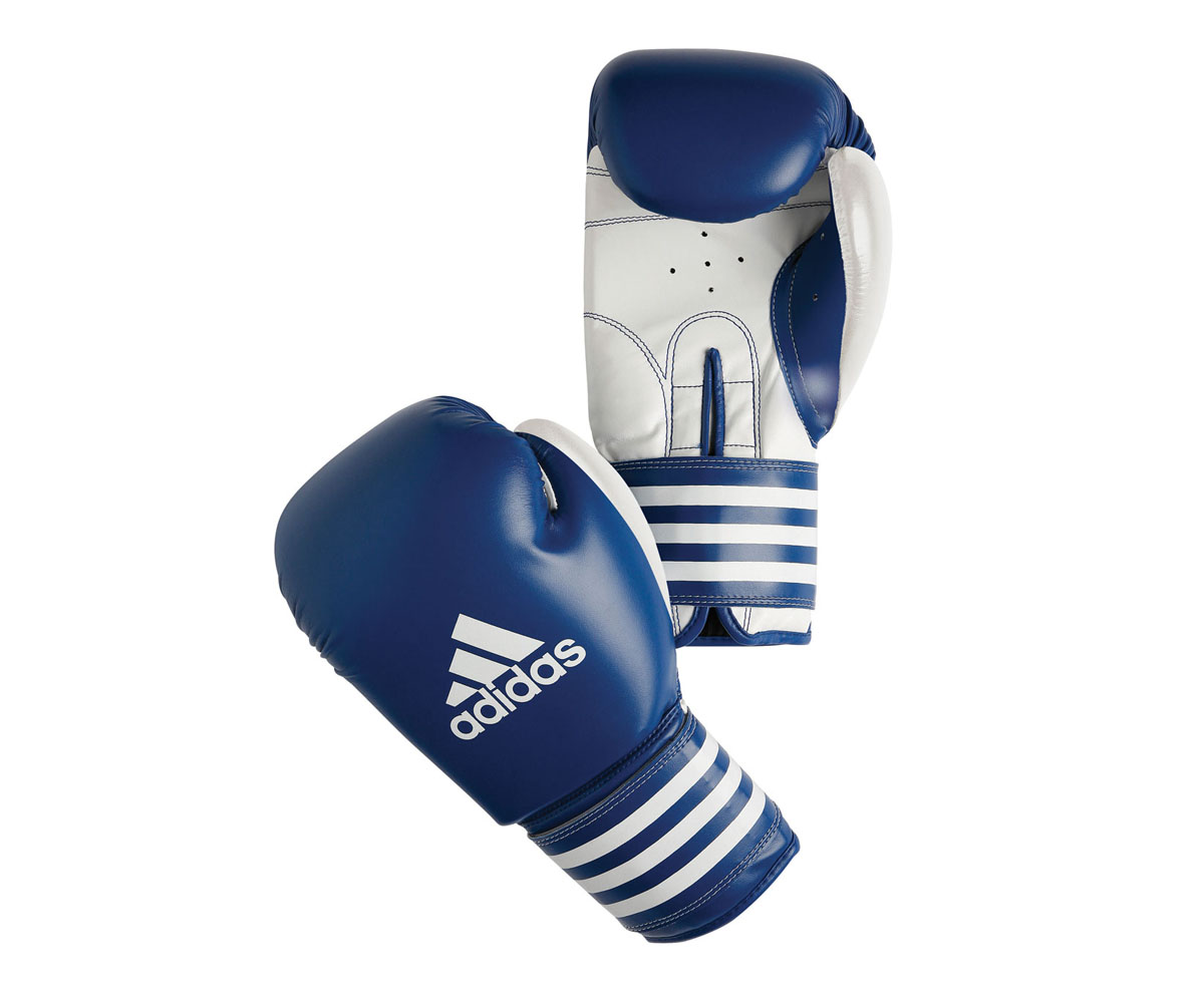Перчатки боксерские Adidas Ultima Competition, цвет: сине-белый. adiBC02. Вес 10 унцийAIRWHEEL M3-162.8 Перчатки боксерские Adidas Ultima Competition, цвет: сине-белый. adiBC02. Вес 10 унцийAIRWHEEL M3-162.8Боксерские перчатки Adidas Ultima Competition для отработок ударов и комбинаций. Тыльная сторона в перчатках выполнена из прочной, износостойкой, натуральной кожи. Внутренний наполнитель, выполненный из формованной под давлением пены с интегрированной внутренней вставкой из геля, выполненной по технологии I-Protech, покрывает тыльную сторону, создавая надежную защиту рук и давая боксеру возможность безопасно тренироваться в полную силу. Внутренняя подкладка, выполненная из дышащего материала, и вентиляционное отверстие на ладони создают комфортный микроклимат внутри перчаток. Эластичный ремешок с фиксацией на липучке позволяет быстро одеть и снять перчатки.