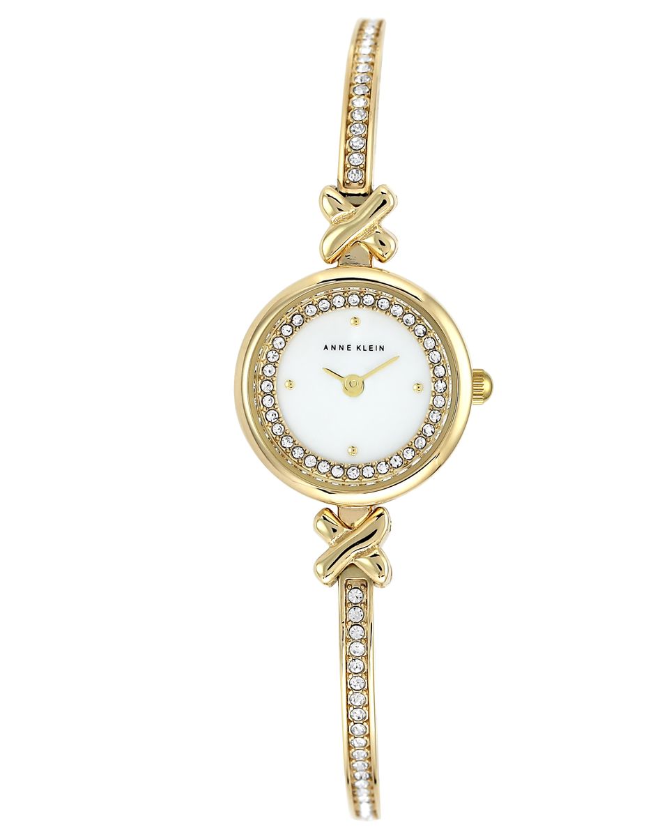 Часы наручные женские Anne Klein, цвет: белый, золотой. 1688MPGB4106черные Часы наручные женские Anne Klein, цвет: белый, золотой. 1688MPGB4106черныеЭлегантные женские часы Anne Klein выполнены из металлического сплава и минерального стекла. Циферблат изделия дополнен вставкой из перламутра, символикой бренда и стразами. Браслет часов оформлен стразами.Корпус часов оснащен кварцевым механизмом, имеет степень влагозащиты равную 3 atm, а также дополнен устойчивым к царапинам минеральным стеклом. Браслет оснащен складным замком, который позволит с легкостью снимать и надевать часы, а также регулировать длину изделия.Часы поставляются в фирменной упаковке.Часы Anne Klein подчеркнут изящность женской руки и отменное чувство стиля у их обладательницы.