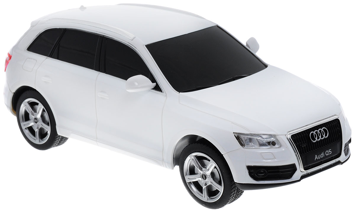 Радиоуправляемая модель Rastar "Audi Q5" станет отличным подарком любому мальчику! Все дети хотят иметь в наборе своих игрушек ослепительные, невероятные и модные автомобили на радиоуправлении. Тем более, если это автомобиль известной марки с проработкой всех деталей, удивляющий приятным качеством и видом. Одной из таких моделей является автомобиль на радиоуправлении Rastar "Audi Q5". Это точная копия настоящего авто в масштабе 1:24. Автомобиль обладает неповторимым стилем и спортивным характером. Потрясающая маневренность, динамика и покладистость - отличительные качества этой модели. Возможные движения: вперед-назад, вправо-влево, остановка. Пульт управления работает на частоте 40 MHz. Машина работает от 3 батареек типа АА (не входят в комплект). Пульт работает от 2 батареек типа АА (не входят в комплект).