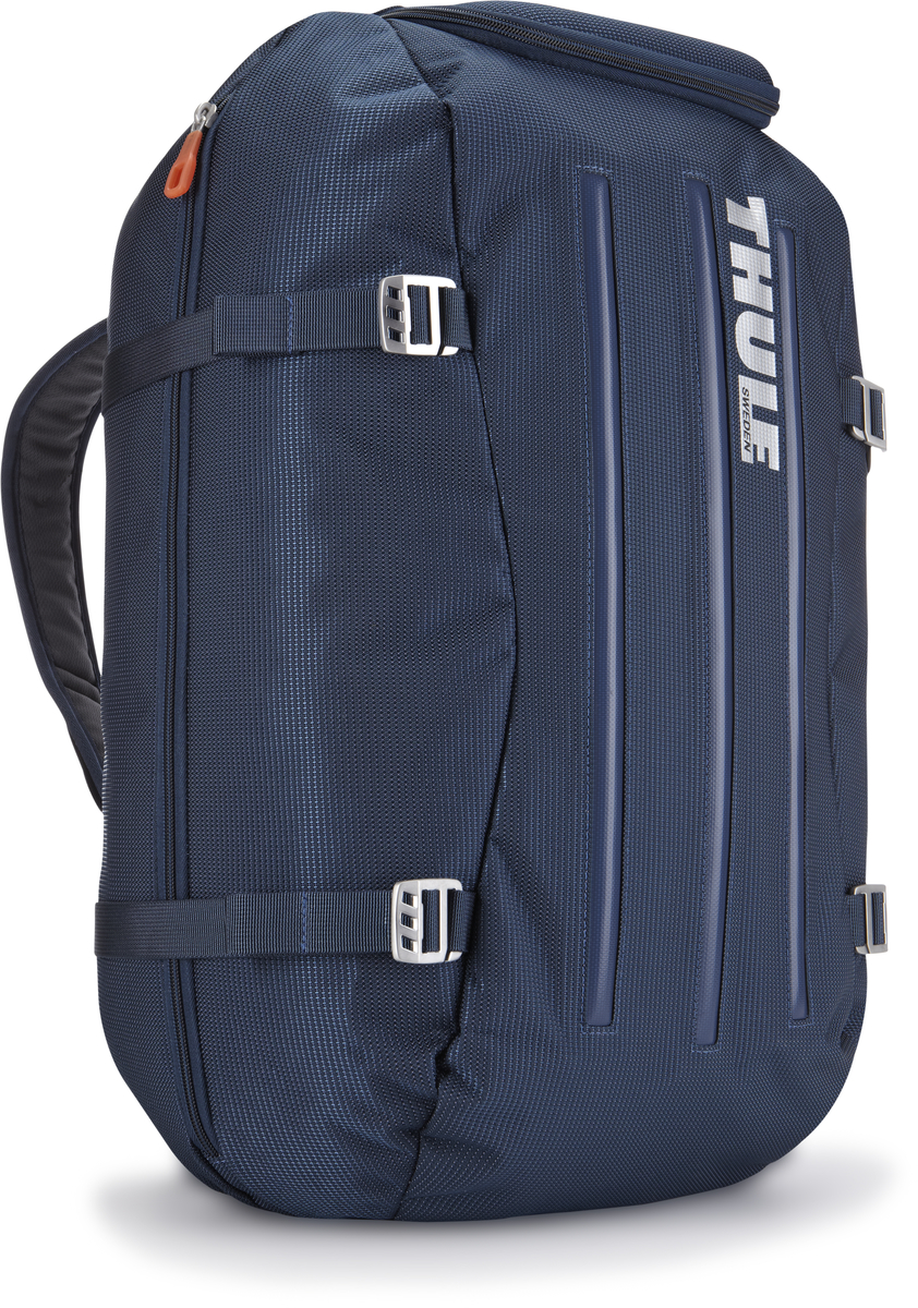 Сумка-рюкзак Thule Crossover Duffel Pack, цвет: темно-синий, 40 л3201083 Сумка-рюкзак Thule Crossover Duffel Pack, цвет: темно-синий, 40 л3201083Туристический рюкзак Thule Crossover 40L идеален для дальних путешествий. Этот гибрид рюкзака и спортивной сумки с молнией сзади обеспечивает сохранность любого содержимого. Алюминиевый каркас и водостойкий материал делают эту сумку легкой, но прочной Изготовленное по технологии горячей прессовки ударопрочное отделение SafeZone защитит ваши очки, портативную электронику и другие хрупкие вещи (отделение запирается и может быть удалено для освобождения дополнительного места). Приподнятые направляющие обеспечивают дополнительную защиту сумки и ее содержимого. Молния на задней стенке позволяет быстро достать из сумки необходимые вещи. Регулировочные ремни для подгонки размера сумки в зависимости от количества багажа Воздухопроницаемые ремни рюкзака Вместительные боковые отделы помогут отделить чистое от грязного, мокрое от сухого и деловое от повседневного.