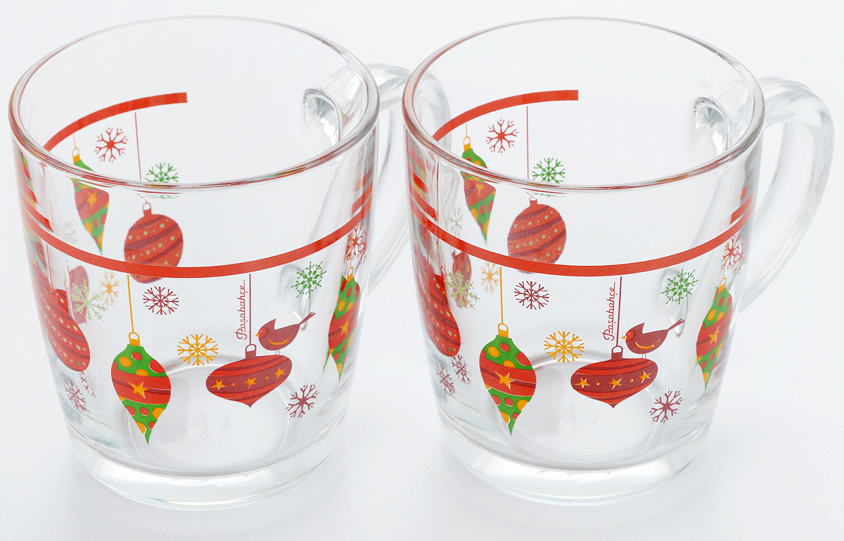 Набор кружек Pasabahce Workshop Christmas Toys, 340 мл, 2 шт54 009312 Набор кружек Pasabahce Workshop Christmas Toys, 340 мл, 2 шт54 009312Набор Pasabahce Workshop Christmas Toys состоит из двух кружек с удобными ручками, выполненных из прочного натрий-кальций-силикатного стекла. Кружки декорированы ярким изображением елочных игрушек. Изделия хорошо удерживают тепло, не нагреваются. На них не выгорает и не вымывается рисунок. Набор кружек Pasabahce Workshop прекрасно оформит праздничный стол и создаст приятную атмосферу за ужином. Такой набор также станет хорошим подарком к любому случаю.Можно мыть в посудомоечной машине.