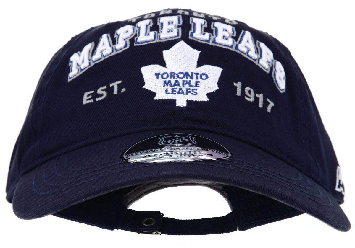 Бейсболка детская NHL Toronto Maple Leafs, цвет: темно-синий. 29039. Размер S/M (52/54)29039 Бейсболка детская NHL Toronto Maple Leafs, цвет: темно-синий. 29039. Размер S/M (52/54)29039Практичная и удобная бейсболка NHL Toronto Maple Leafs, выполненная из высококачественного хлопка, идеально подойдет вашему ребенку для активного отдыха и обеспечит надежную защиту головы от солнца. Бейсболка дополнена широким твердым козырьком и оформлена вышивкой в виде эмблемы профессиональной хоккейной команды Toronto Maple Leafs, а также вышитыми надписями. Кепка имеет перфорацию, обеспечивающую необходимую вентиляцию. Объем изделия регулируется металлическим фиксатором. Такая бейсболка станет отличным аксессуаром для занятий спортом или дополнит повседневный образ вашего ребенка.