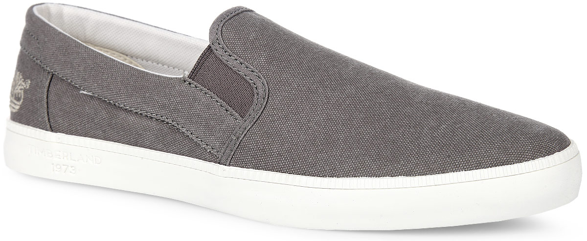 Слипоны мужские Timberland Canvas Plain Toe Slip-On, цвет: серо-коричневый. TBLA14VGM. Размер 11,5 (44,5)TBLA14VGM Слипоны мужские Timberland Canvas Plain Toe Slip-On, цвет: серо-коричневый. TBLA14VGM. Размер 11,5 (44,5)TBLA14VGMМодные мужские слипоны Canvas Plain Toe Slip-On от Timberland заинтересуют вас своим дизайном с первого взгляда! Модель, изготовленная из 100% хлопка, оформлена вышивкой в виде логотипа бренда. Эластичные вставки по бокам обеспечивают идеальную посадку модели на ноге. Стелька из материала EVA с текстильной поверхностью обеспечивает максимальный комфорт при движении. Рифление на подошве гарантирует идеальное сцепление с поверхностью. Стильные слипоны займут достойное место в вашем гардеробе.