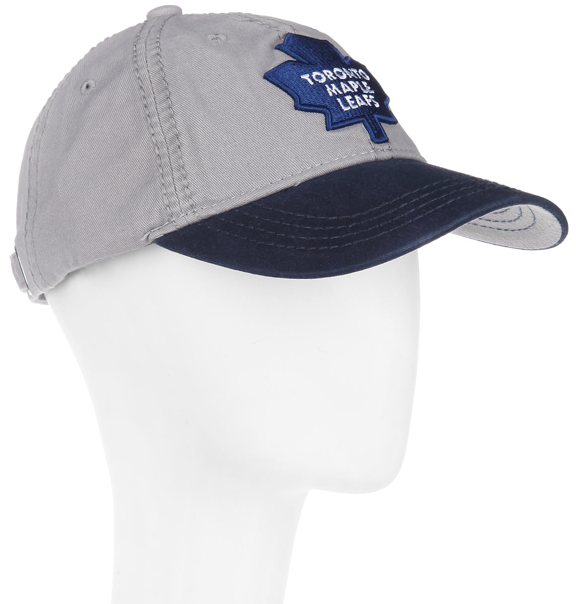 Бейсболка NHL Toronto Maple Leaf, цвет: серый, темно-синий. 29057. Размер L\XL (55-58)29057 Бейсболка NHL Toronto Maple Leaf, цвет: серый, темно-синий. 29057. Размер L\XL (55-58)29057Практичная и удобная бейсболка NHL Toronto Maple Leaf, выполненная из высококачественного хлопка, идеально подойдет для активного отдыха и обеспечит надежную защиту головы от солнца.Бейсболка дополнена широким твердым козырьком и оформлена вышивкой в виде эмблемы профессиональной хоккейной команды Toronto Maple Leaf, а также вышитыми надписями. Кепка имеет перфорацию, обеспечивающую необходимую вентиляцию. Объем изделия регулируется металлическим фиксатором. Такая бейсболка станет отличным аксессуаром для занятий спортом или дополнит ваш повседневный образ.