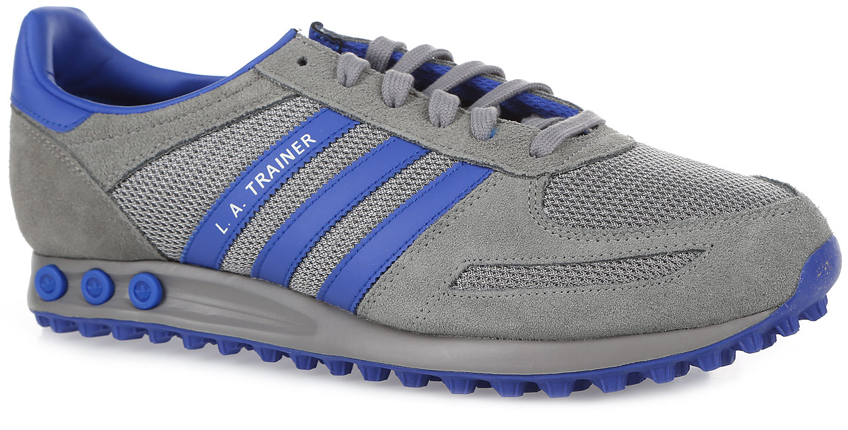 Кроссовки мужские adidas Originals LA Trainer, цвет: серый, синий. S76060. Размер 11,5 (45)S76060 Кроссовки мужские adidas Originals LA Trainer, цвет: серый, синий. S76060. Размер 11,5 (45)S76060Прошли десятилетия с дебюта кроссовок LA Trainer от adidas Originals, но они до сих пор вызывают восхищение. Эта версия является переизданием оригинальной модели 1981 года. Аутентичный верх из натуральной замши и сетки дополнен контрастными деталями. Три вынимаемые вставки-колышки позволяют регулировать уровень амортизации. Стелька из EVA с текстильной поверхностью комфортна при движении в течение всего дня. Литая промежуточная подошва из материала EVA обладает высокой износостойкостью и обеспечивает идеальную амортизацию. Зубчатая резиновая подошва с протектором гарантирует идеальное сцепление с любыми поверхностями. Классическая шнуровка надежно фиксирует модель на ноге.