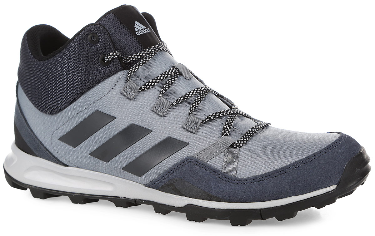 Кроссовки мужские adidas Tivid Mid, цвет: серый, черный. AQ2578. Размер 7,5 (40)AQ2578 Кроссовки мужские adidas Tivid Mid, цвет: серый, черный. AQ2578. Размер 7,5 (40)AQ2578Легкие мужские кроссовки средней высоты Tivid Mid от adidas одинаково хороши как для несложных пеших походов, так и для прогулок по городу. Модель с прочным верхом из рипстопа дополнена замшевыми вставками. По бокам модель оформлена фирменными тремя полосками. Легкая упругая промежуточная подошва из ЭВА сохраняет свои свойства в течение длительного времени. Резиновая подошва Traxion и специальный глубокий протектор адаптированы для максимального сцепления даже с мокрыми поверхностями. Классическая шнуровка надежно зафиксирует модель на ноге.