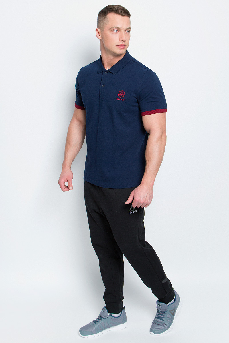 Поло мужское Reebok F Polo, цвет: синий. BK5150. Размер L (52/54)BK5150 Поло мужское Reebok F Polo, цвет: синий. BK5150. Размер L (52/54)BK5150Мужское поло Reebok F Polo изготовлено из натурального хлопка.Модель с короткими рукавами и отложным воротником застегивается спереди на две пуговицы. Передняя часть декорирована оригинальной вышивкой. Манжеты рукавов дополнены трикотажными резинками контрастного цвета. По бокам поло дополнено небольшими разрезами. Спинка слегка длиннее передней части поло. Стильное и современное оформление этой модели заметно подчеркнет вашу индивидуальность.