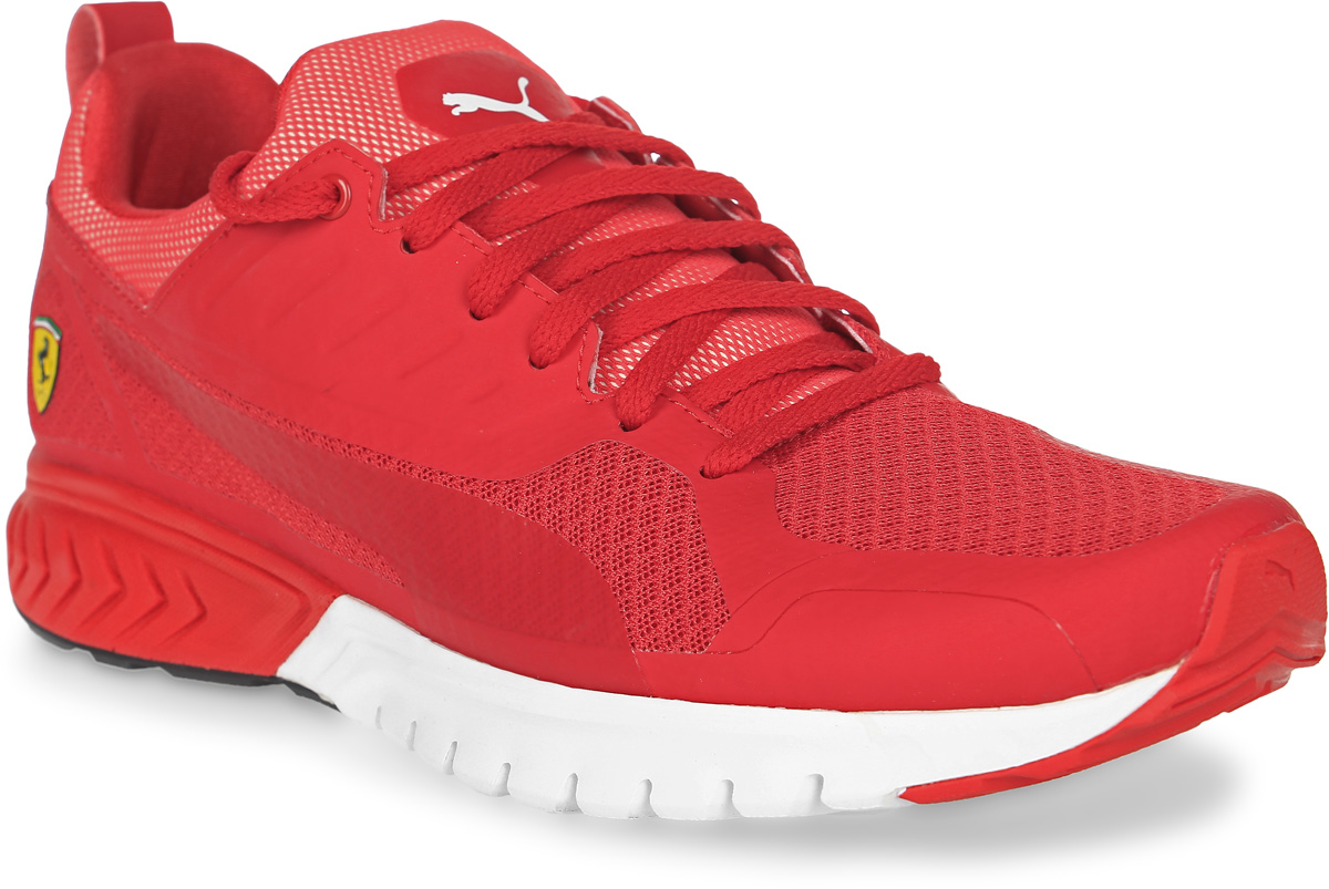 Кроссовки мужские Puma Sf Pitlane Ignite Dual, цвет: красный. 30590301. Размер 11 (45)30590301 Кроссовки мужские Puma Sf Pitlane Ignite Dual, цвет: красный. 30590301. Размер 11 (45)30590301Модель Puma Pitlane SF развивает традиции и стиль функциональной обуви легендарных автомехаников Формулы-1. Верх из специального сетчатого материала, промежуточная подошва с пенным материалом Faas Foam+, создающая дополнительную амортизацию, и наружная сторона подошвы из маслонепроницаемой резины делают эту модель особенно привлекательной для автолюбителя. Символика Ferrari широко представлена в данной модели, в том числе в виде логотипа гоночной команды Ferrari из термополиуретана сбоку, эмблемы Ferrari на союзке и тканого итальянского флага, пристроченного сбоку ближе к заднику.