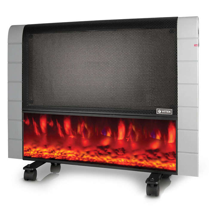 Vitek VT-2145(BK) тепловентиляторVT- 2145(BK) Vitek VT-2145(BK) тепловентиляторVT- 2145(BK)Тепловентилятор VITEK VT-2145 BK выполнен в оригинальном исполнении в виде камина. Такое решение очень стильно будет смотреться в любой квартире, отделанной по самой современной моде. Установка прибора может быть произведена как на стену, так и на потолок при помощи специальных приспособлений. Для напольной установки с целью удобства предусмотрены колесики. Работая в двух режимах при мощности в 600 и 1200 Ватт, тепловентилятор VITEK VT-2145 BK может обогреть помещение площадью до 25 м2. В случае падения прибора предусмотрено автоматическое отключение. Но главная особенность заключается в отображении пламени как у настоящего камина, в двух уровнях.