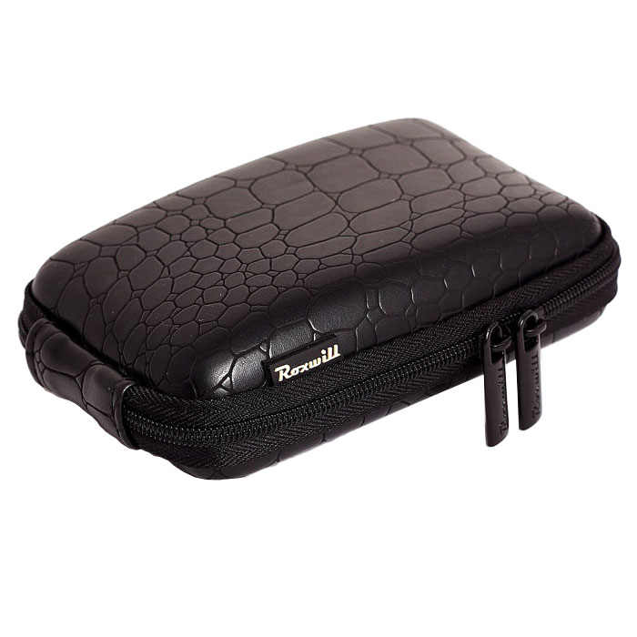 Roxwill C40 Croco, Black чехол для фото- и видеокамерC40 croco black Roxwill C40 Croco, Black чехол для фото- и видеокамерC40 croco blackRoxwill C40 Croco - стильный и надежный чехол для компактных фотокамер. Он гарантированно защитит вашу камеру от случайных ударов и царапин, а также от пыли и влаги. Изделие изготовлено из EVA (вспененная резина). Данный материал не подлежит воздействию агрессивных веществ и предохраняет фотоаппарат при падении. Для переноски предусмотрен регулируемый шейный ремешок и возможность крепления на поясном ремне.
